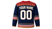 Load image into Gallery viewer, USA Patriotic Liberty Bell Crest Hockey Jersey in Liberty Navy, back view with your name and number – starry bell-and-ribbon yoke with ribbon sleeve bands and gold-edged hem band