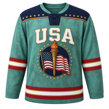 Load image into Gallery viewer, USA Patriotic Liberty Torch Flame Hockey Jersey in Patina Teal, front view – gold liberty torch wrapped in a flowing American flag ribbon, custom name and number