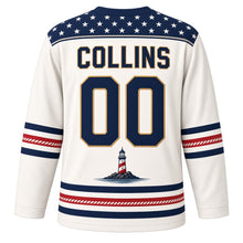 Load image into Gallery viewer, USA Patriotic Lighthouse Coast Beacon Hockey Jersey in Sea Foam White, back view with your name and number – yoke of small white stars on navy edged with a thin twisted-rope line, matching sleeve and hem stripes