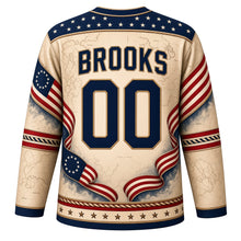 Load image into Gallery viewer, USA Patriotic Revolutionary Drum Corps Hockey Jersey in Drumhead Parchment, back view with your name and number – a decorative yoke of tiny parchment-colored stars on navy with a fine rope-cord border yoke, matching sleeve and hem bands