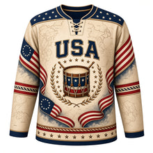 Load image into Gallery viewer, USA Patriotic Revolutionary Drum Corps Hockey Jersey in Drumhead Parchment, front view – antique colonial snare drum with crossed drumsticks and 13-star flag ribbons, custom name and number