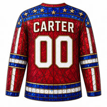 Load image into Gallery viewer, USA Patriotic Stained Glass Stars Hockey Jersey in Ruby Glass, back view with your name and number – a decorative yoke of small sapphire and gold glass star panes with lead lines yoke, matching sleeve and hem bands