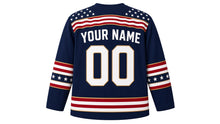 Load image into Gallery viewer, USA Patriotic Vintage Waving Flag Hockey Jersey in Vintage Navy, back view with your name and number – flowing flag-stripe ripple yoke with matching sleeve and hem bands