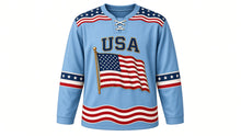 Load image into Gallery viewer, USA Patriotic Vintage Waving Flag Hockey Jersey in Faded Sky, front view – large rippling American flag crest on a wooden pole, flowing flag-stripe yoke, custom name and number, custom name and number