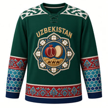 Load image into Gallery viewer, Uzbekistan Original Hockey Jersey in Fergana Green, front view – ornate suzani rosette crest with pomegranate, cotton and doira drum, ikat yoke, detailed artwork, custom name and number