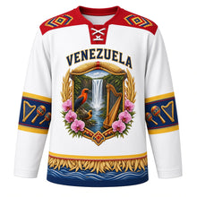 Load image into Gallery viewer, Venezuela Original Hockey Jersey in Tepui Mist White, front view – ornate tepui crest with Angel Falls, araguaney blossoms and a turpial, Wayuu-inspired woven yoke, detailed artwork, custom name and number
