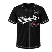 Load image into Gallery viewer, Vinyl Record Shop Milwaukee Baseball Jersey in Jet Black, front view – vinyl record and sound-wave graphic with equalizer crest, custom name and number
