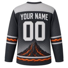 Load image into Gallery viewer, Volcanic Eruption Original Hockey Jersey in Basalt Ember, back view with your name and number – hexagonal basalt yoke and cracked lava hem stripes