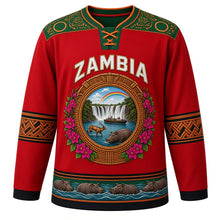 Load image into Gallery viewer, Zambia Original Hockey Jersey in Bougainvillea Red, front view – ornate woven-basket roundel with Victoria Falls, Kuomboka barge and Kafue lechwe, chitenge yoke, detailed artwork, custom name and number