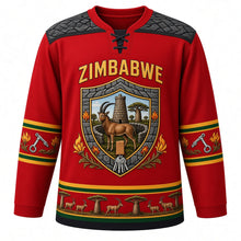 Load image into Gallery viewer, Zimbabwe Original Hockey Jersey in Flame Lily Red, front view – ornate stone-block shield crest with sable antelope, Great Zimbabwe walls and flame lilies, chevron masonry yoke, detailed artwork, custom name and number