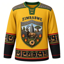 Load image into Gallery viewer, Zimbabwe Original Hockey Jersey in Kopje Gold, front view – ornate stone-block shield crest with sable antelope, Great Zimbabwe walls and flame lilies, chevron masonry yoke, detailed artwork, custom name and number